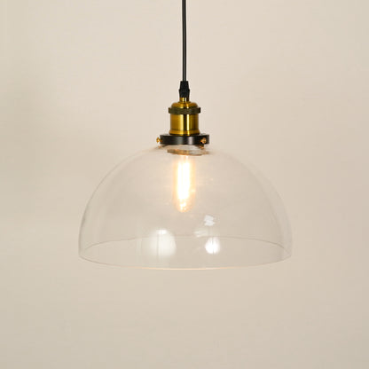 White background image of transparent dome hanging light illuminated for modern living room decor styling and home lighting.