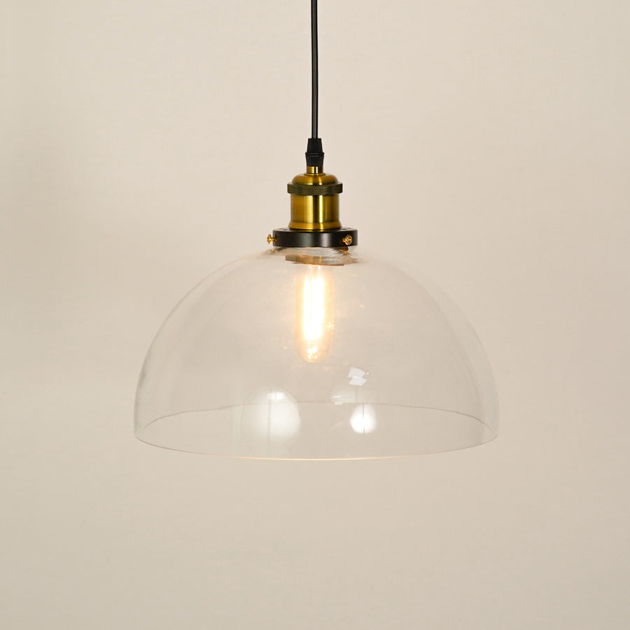 White background image of transparent dome hanging light illuminated for modern living room decor styling and home lighting.