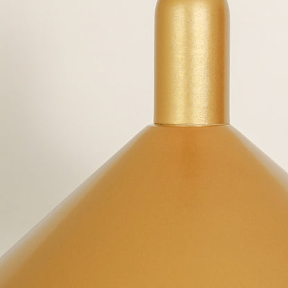 Closeup of matte gold metal pendant light showcasing textured finish and refined craftsmanship.