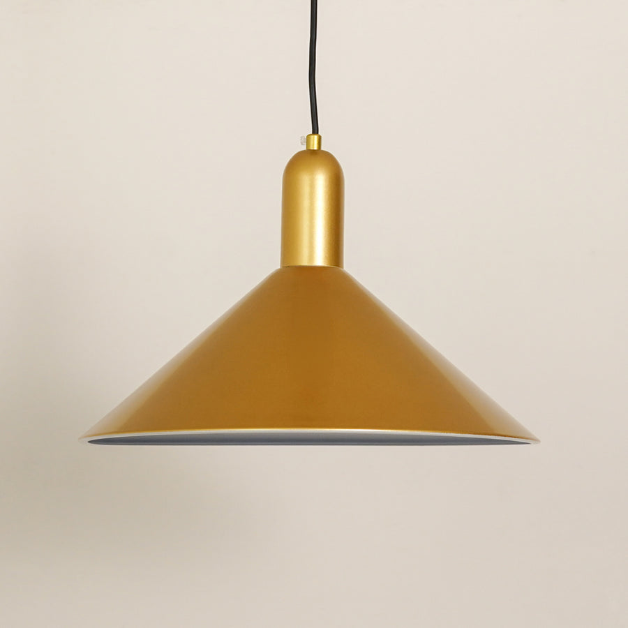 Matte gold metal pendant light with smooth finish illuminating elegant modern spaces.