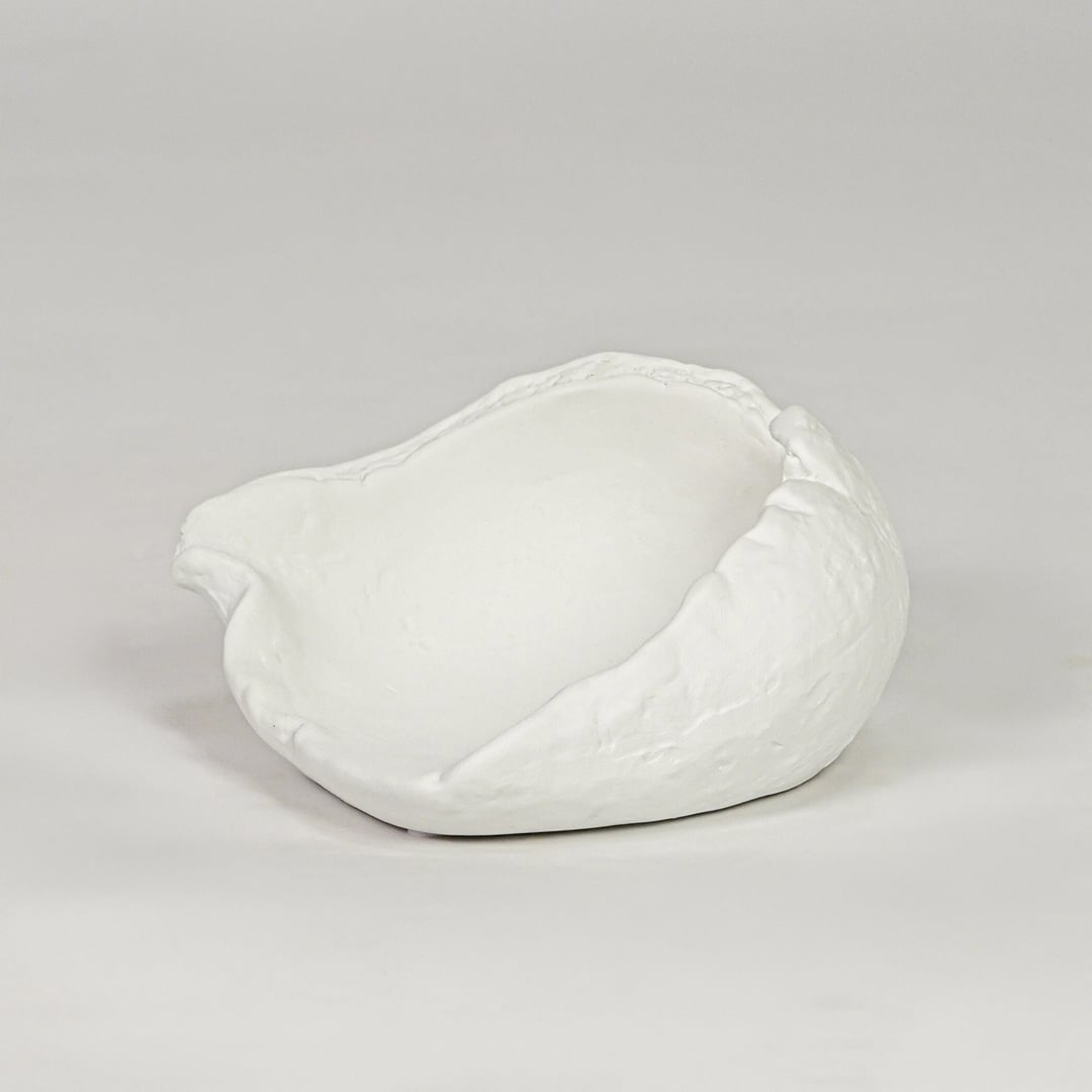 White ceramic decorative bowl with textured finish modern centerpiece bowl for table console living room decor styling.