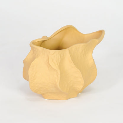 Yellow textured ceramic planter bowl for stylish console table placement and contemporary indoor decor styling.