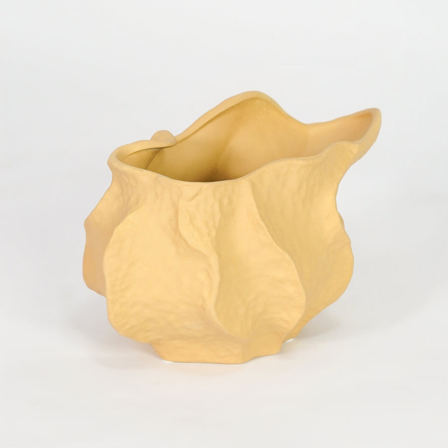 Yellow textured ceramic planter bowl for stylish console table placement and contemporary indoor decor styling.