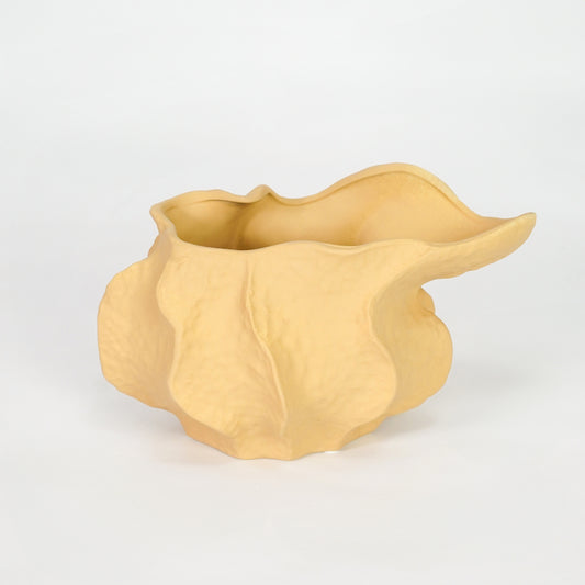 Yellow sculptural ceramic bowl for modern coffee table placement and artistic indoor decor styling centerpiece accent.