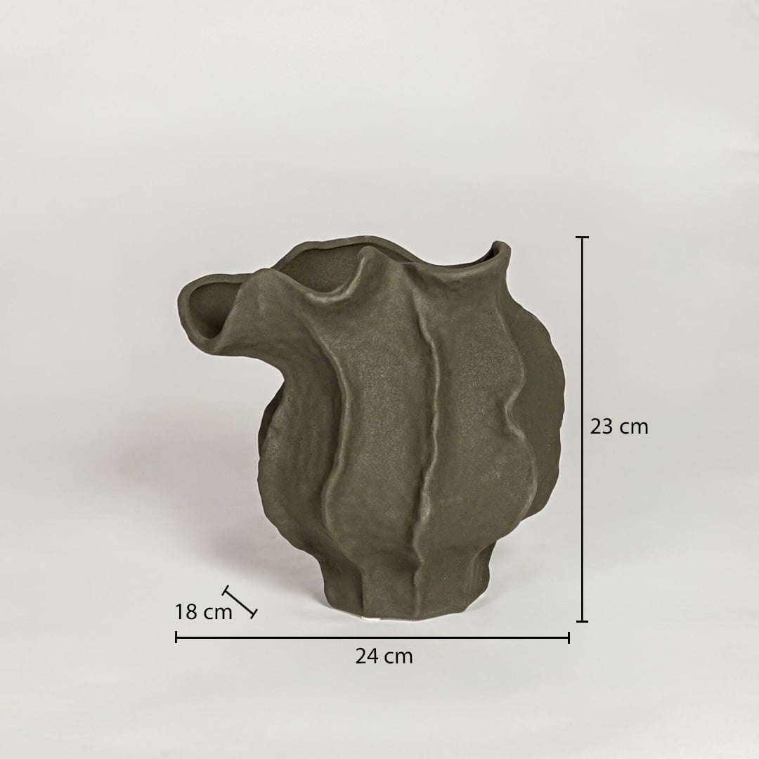 Dark green ceramic sculpted vase measuring 23 cm height 24 cm width and 18 cm depth ideal for modern decor placement.