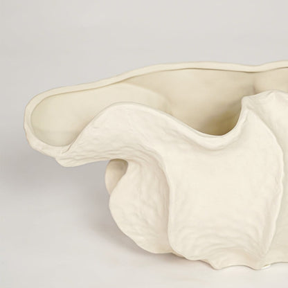 Close view of white doof table ceramic vase small featuring flowing organic form and soft matte finish.