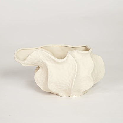 White doof table ceramic vase small with flowing abstract form isolated on clean white background for tabletop decor use.