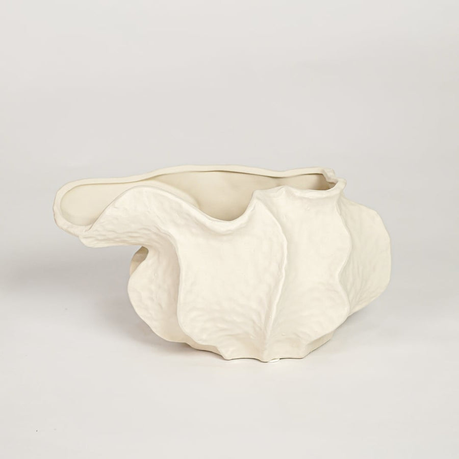 White doof table ceramic vase small with flowing abstract form isolated on clean white background for tabletop decor use.