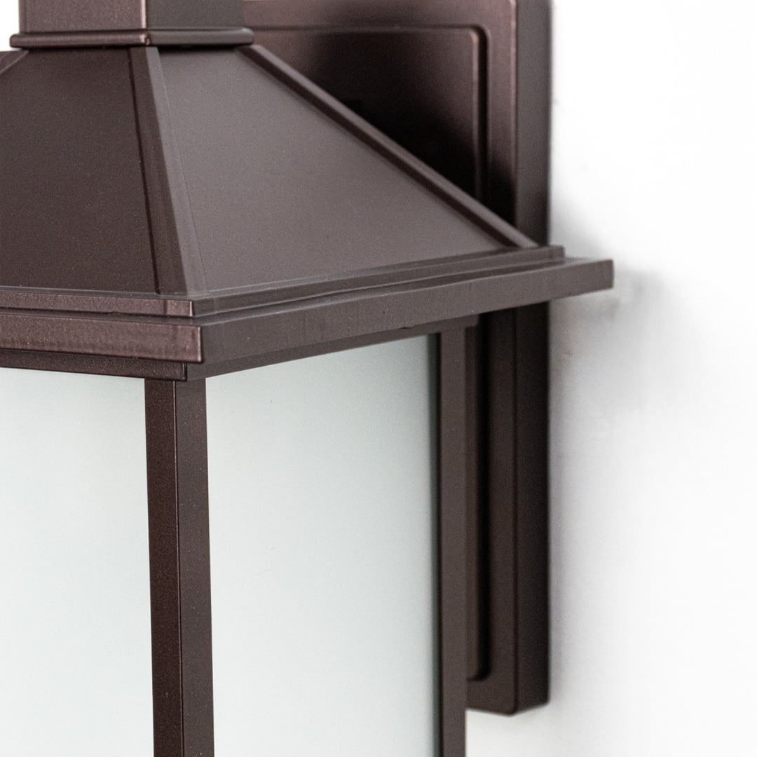 Closeup of Dorm outdoor wall light crafted in metal displaying sturdy structure refined finish and functional exterior wall lighting style.