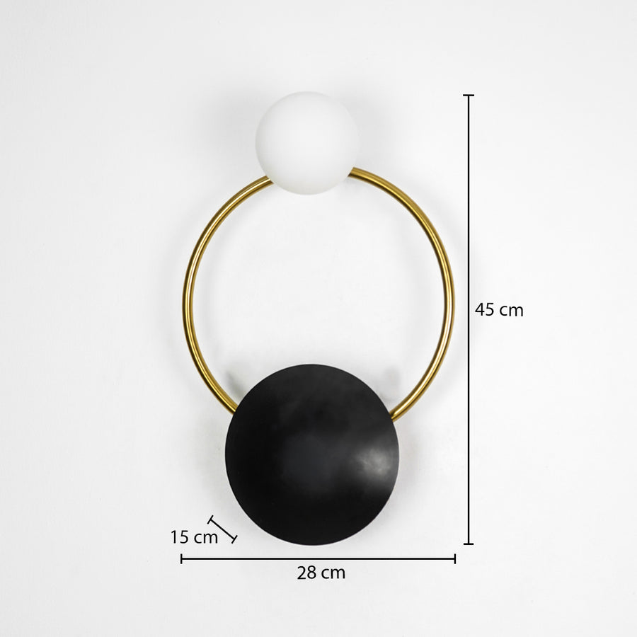 Modern gold wall light with black and white globe shades measuring 45 cm height 20 cm width and 15 cm depth on white.