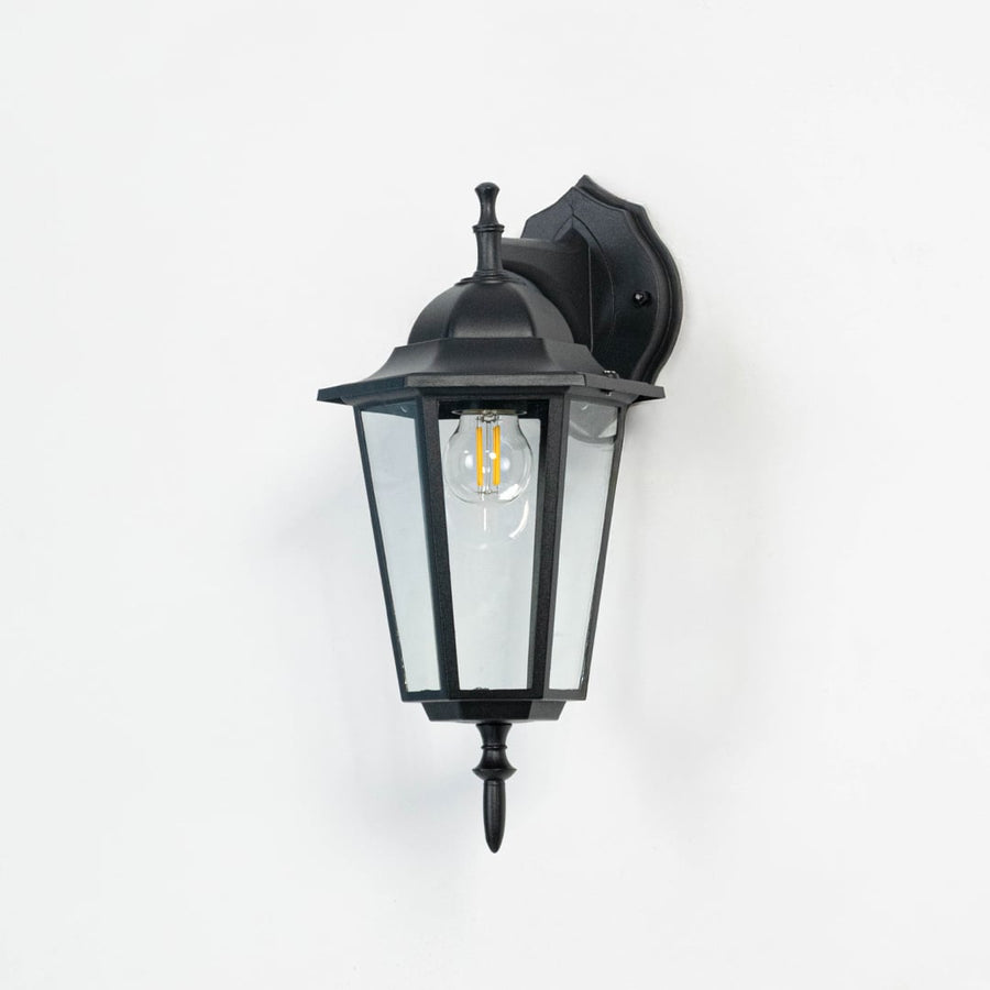 Unlit outdoor wall light in matte black finish displayed on white background highlighting smooth frame and crisp structure.
