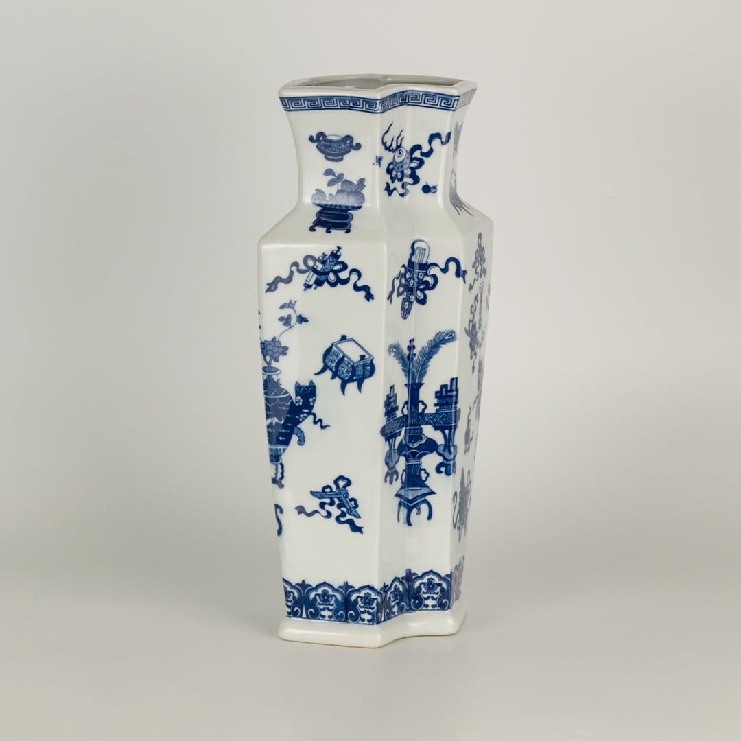Blue and white ceramic decorative vase with traditional floral pattern for modern shelf styling and home decor displays.