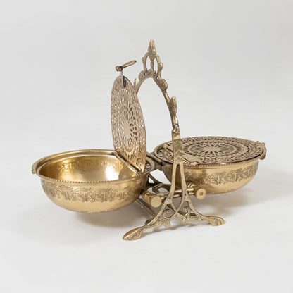 Decorative metal basket set in gold finish with handle for dining table or serving decor accessory placement white background.