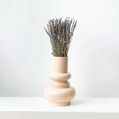 Minimal dried lavender stem in soft beige and purple placed on a white background ideal for calm modern home decor.