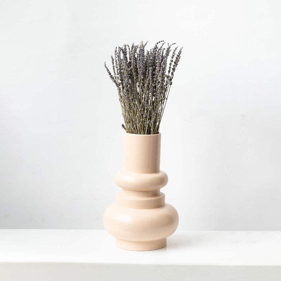 Minimal dried lavender stem in soft beige and purple placed on a white background ideal for calm modern home decor.