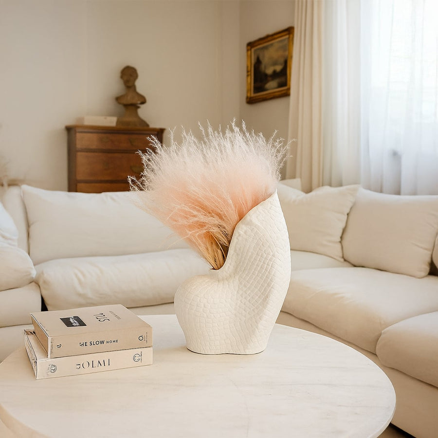 Peach dried pampas grass bunch held in hand perfect for boho home decor and vase styling adds soft natural charm.