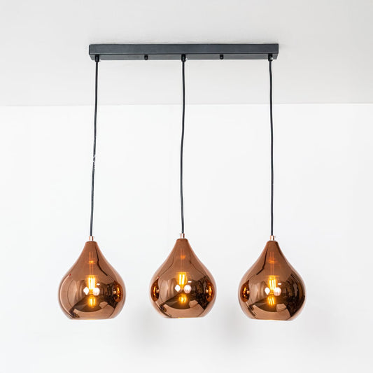 Warm lit copper metal teardrop pendant lights with adjustable hanging wires displayed against a white background for decor styling.