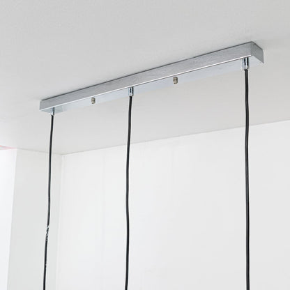 Silver metal linear canopy with suspended cords highlighting sleek modern craftsmanship and finish.