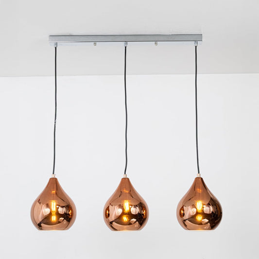 Amber glass pendant lights with metallic finish designed for elegant contemporary home decor spaces.