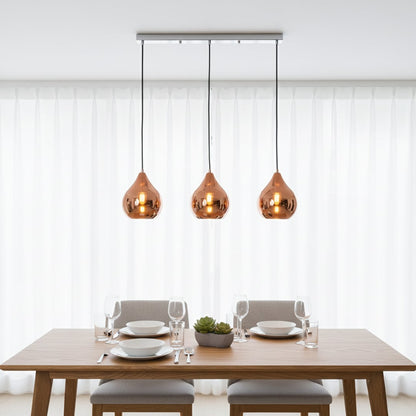 Amber glass pendant lights creating warm ambience above the dining table in modern interiors.