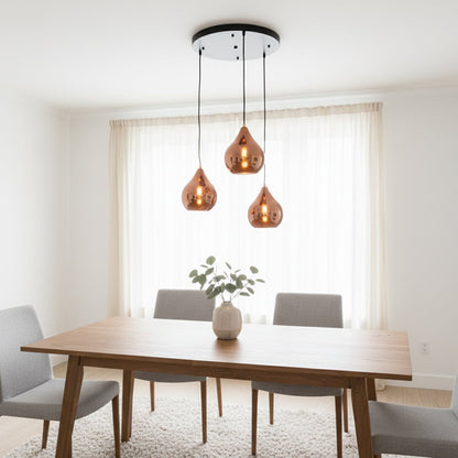 Amber glass pendant lights creating warm ambience above the dining table in modern interiors.