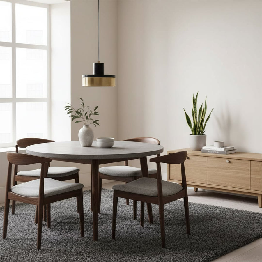 Minimal pendant light with metal body hanging near wall adding subtle warm lighting and clean modern touch to interior space.