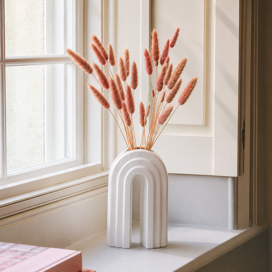 Lifestyle image of copper pink bunny tail dried pampas grass for elegant home interior decor styling and room interiors.