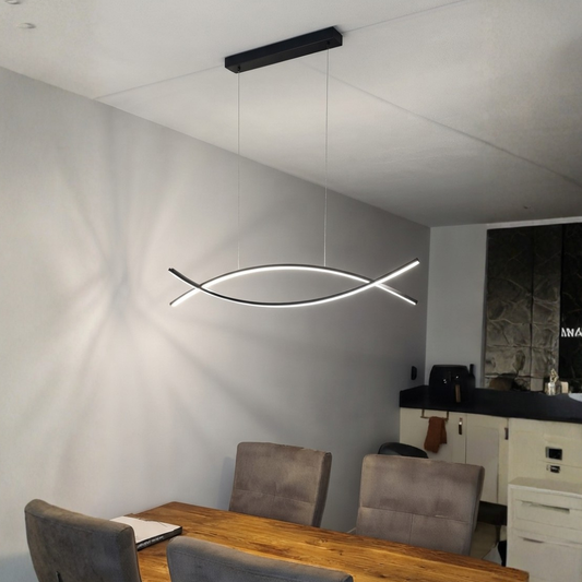 Lifestyle image of dual curve metal linear light for elegant dining room decor styling and modern home interior design.