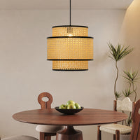 Natural rattan pendant light with black metal frame for dining room kitchen island and warm ambient lighting.