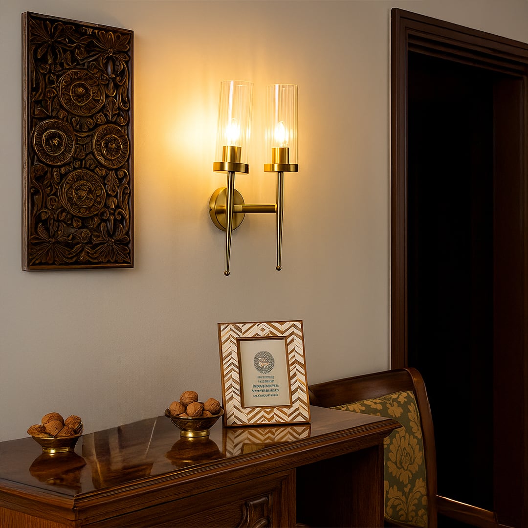 Elegant double glass wall light shining warmly in a classic interior beside carved decor and wooden furniture creating a cozy ambient glow for the room.
