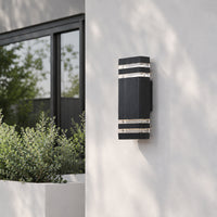 Black metal outdoor LED wall light with horizontal slats for porch entrance and exterior walls with warm lighting.