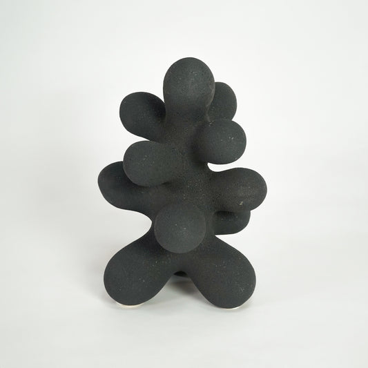 Black textured abstract sculpture for elegant console table placement and contemporary indoor decor styling accent.