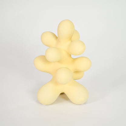 Yellow abstract decor sculpture for stylish shelf placement and modern indoor home decor styling accent piece.