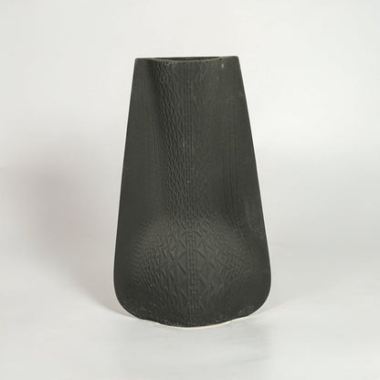 Black decorative ceramic vase on white background modern home decor accent piece for table floor console styling interior.