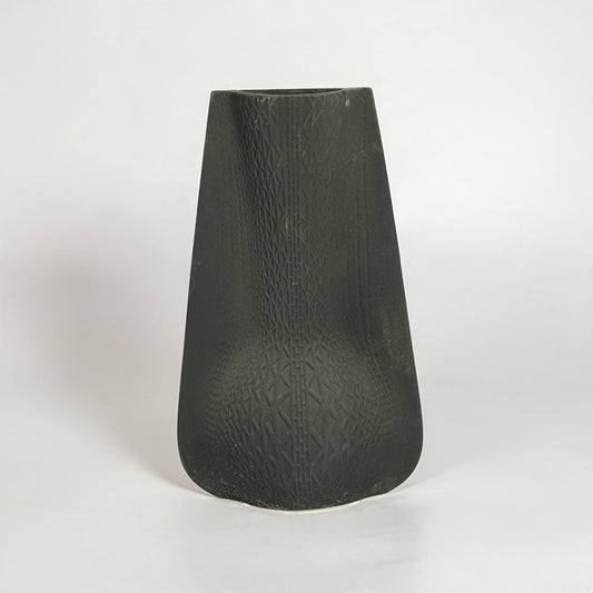 Black decorative ceramic vase on white background modern home decor accent piece for table floor console styling interior.