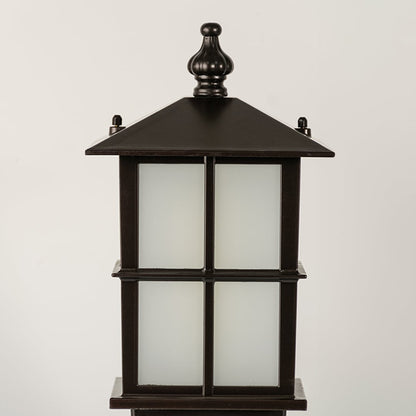 Closeup of black outdoor gate light with frosted glass panels for luxury exterior decor styling use.