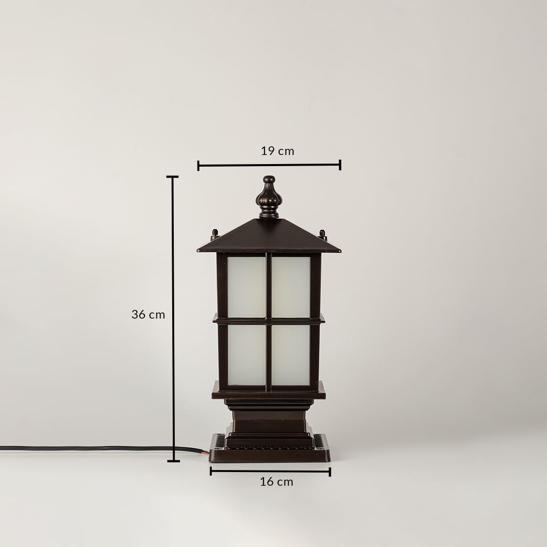Closeup of black outdoor gate light with frosted glass panels for luxury exterior decor styling use.