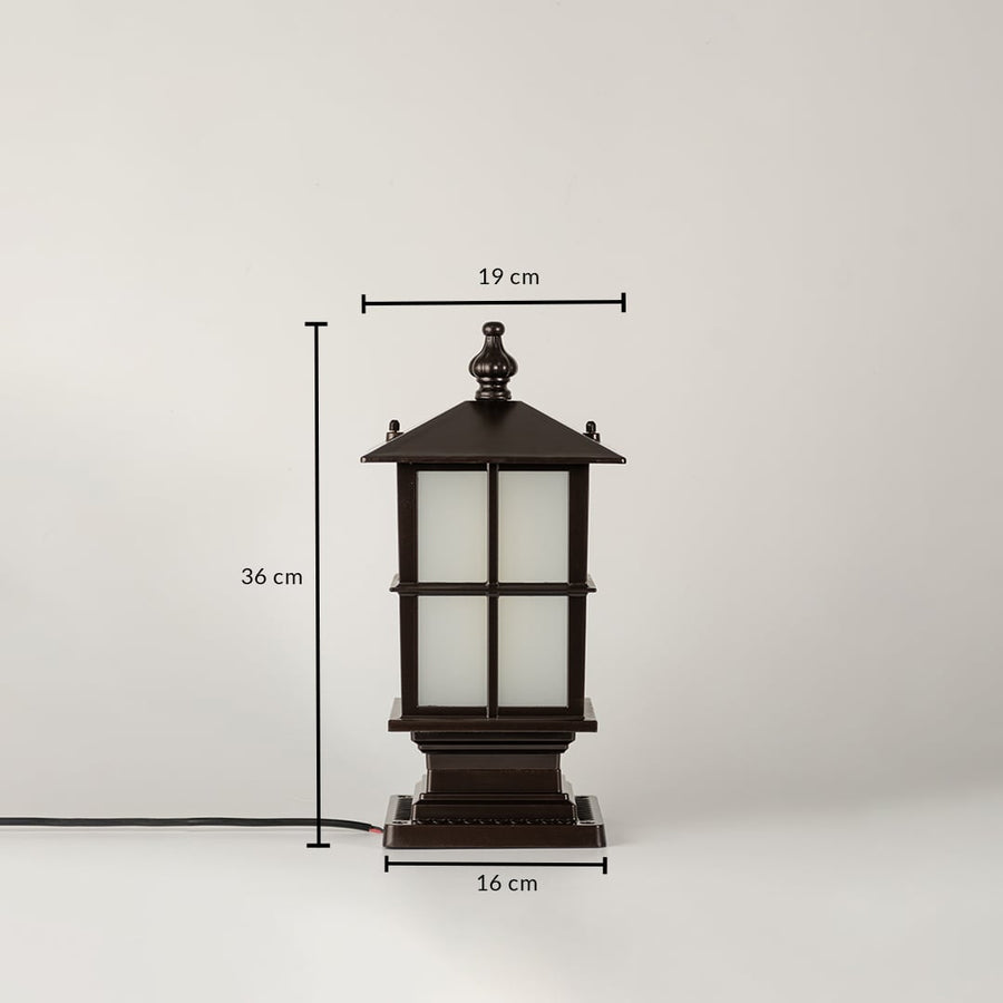 Closeup of black outdoor gate light with frosted glass panels for luxury exterior decor styling use.