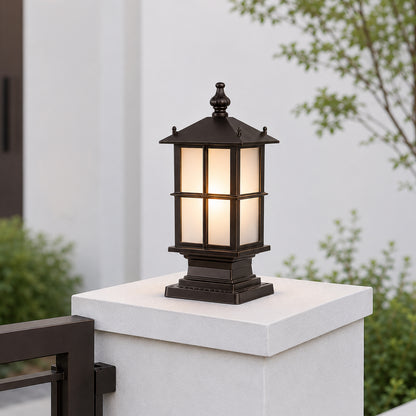 Modern black metal outdoor pillar light for gate entrance garden fence and driveway with warm ambient illumination.