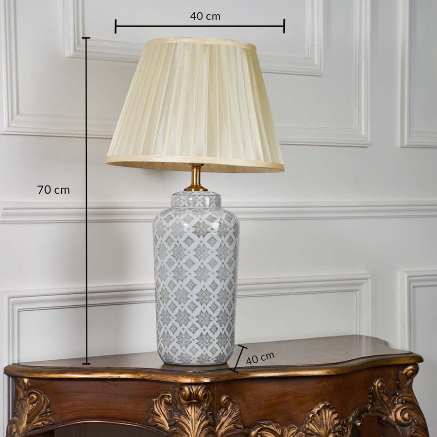 Table lamp with grey patterned ceramic base and pleated shade displayed with height and width measurements clearly marked.