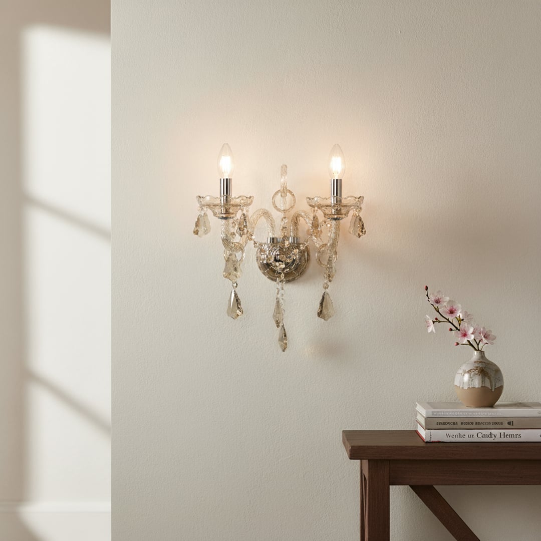 Wall light with champagne glass frame and crystal droplets styled on a soft wall background for elegant warm home lighting.