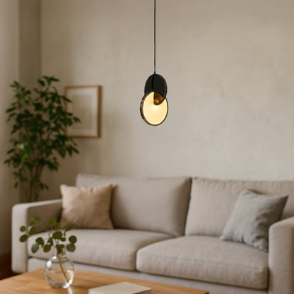 Luna disc pendant light turned off featuring circular design with metallic finish and clean white background.