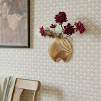Gold finish metal leaf wall hook with textured design for hanging keys towels bags and elegant wall decor accents.