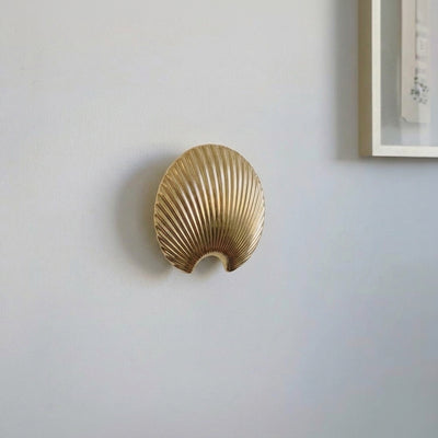Gold finish metal leaf wall hook with sculpted texture for stylish wall mounting and everyday home organization.