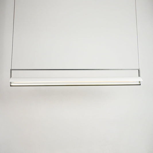 Minimal linear hanging light with sleek metal finish on clean neutral background ideal for modern kitchen or dining lighting.