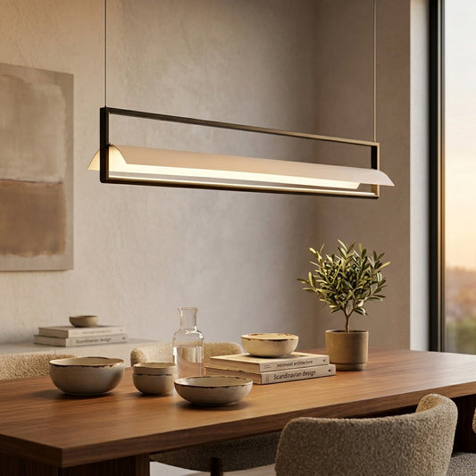 Modern linear pendant light with slim metal bar installed above dining table in contemporary kitchen interior creating warm ambient lighting.