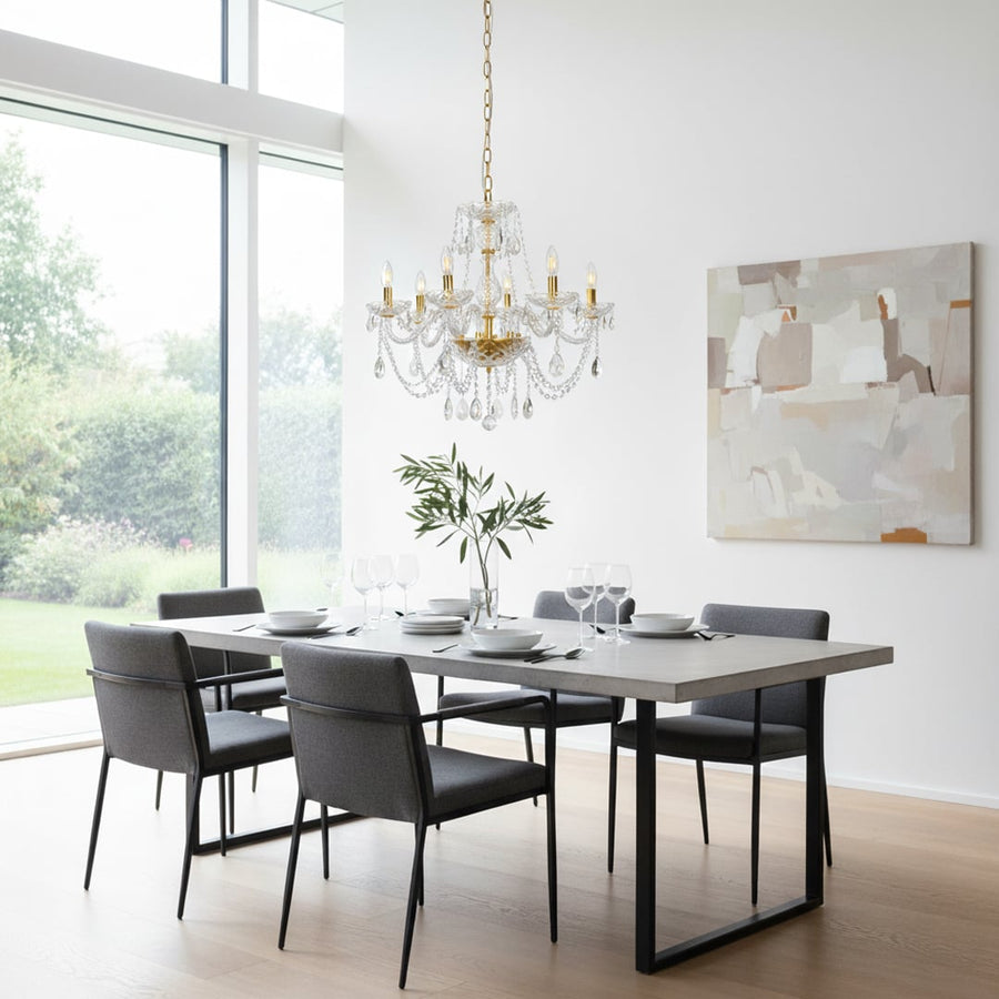 Gold metal crystal chandelier adds bright elegant lighting to living room or dining room ceilings creating a luxury ambience.