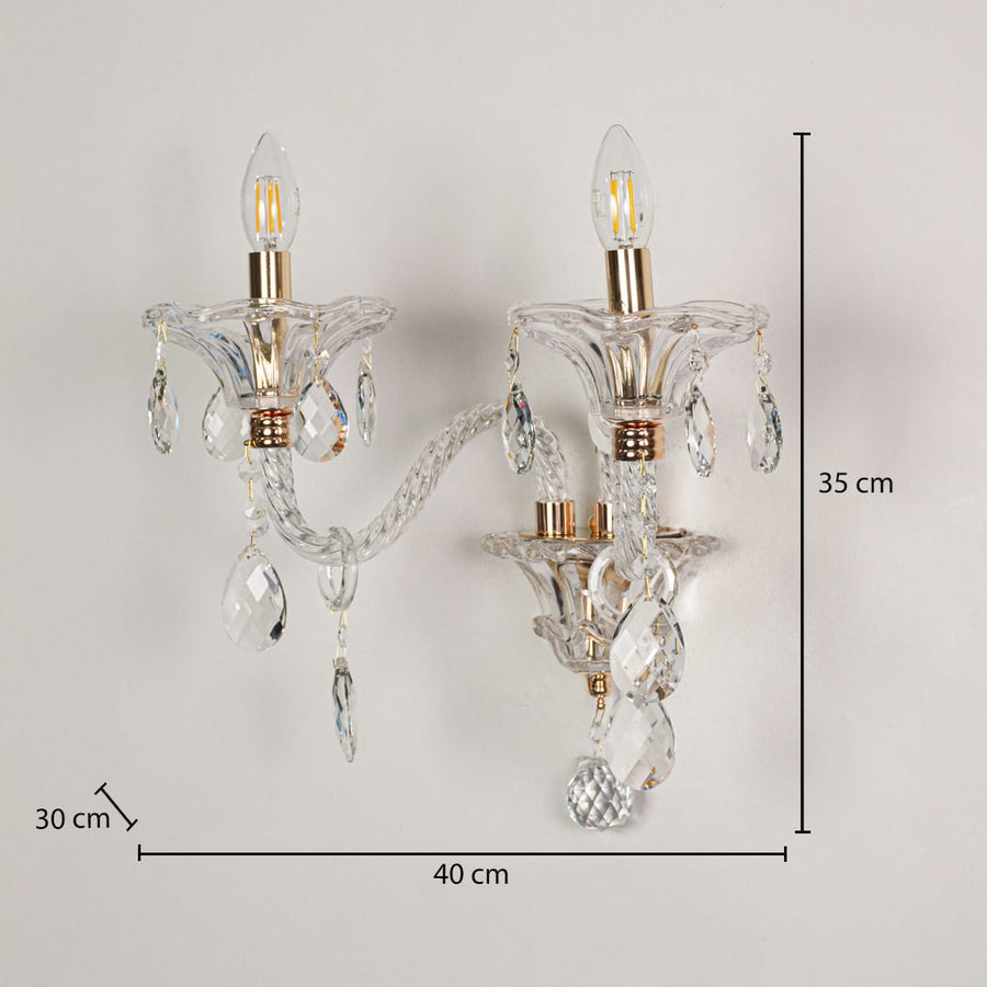 Clear crystal wall light with gold accents sized 35 cm height and 40 cm width with 30 cm depth ideal for elegant hallway or living room walls.