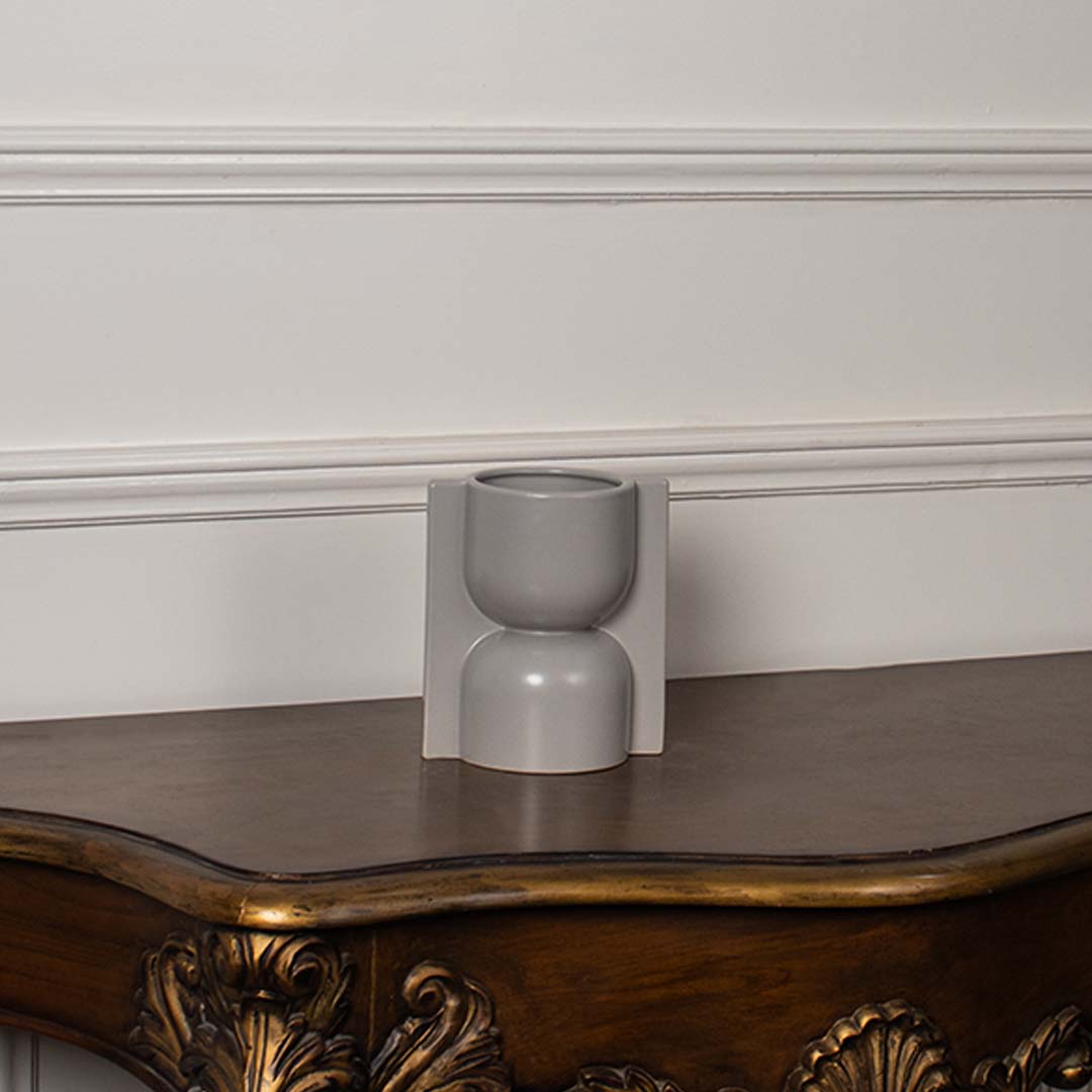 Light grey geometric ceramic vase displayed on a clean white background ideal for minimal home decor and stylish tabletop accents.