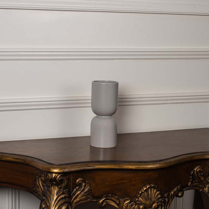 Light grey double form ceramic vase styled with matching decor pieces perfect for modern interiors and refined artistic home styling.